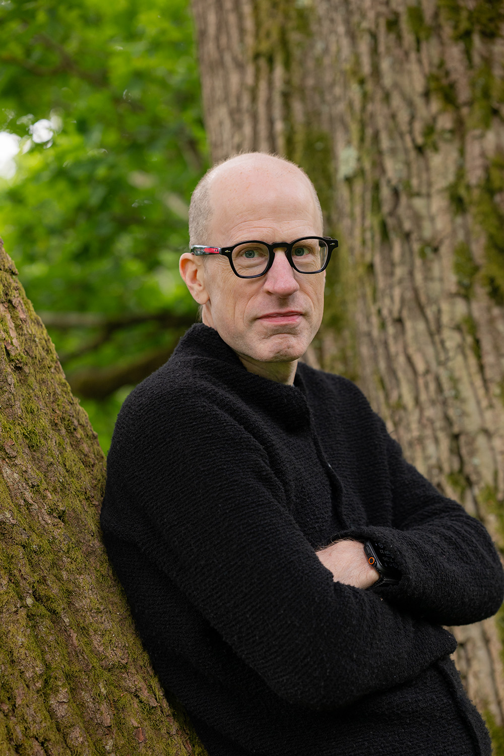 Outdoors portrait of Nick Bostrom leaning against a tree
